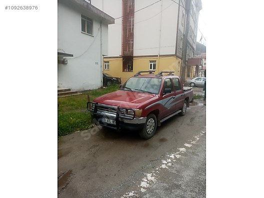 1999 maroon toyota hilux 4x4 pickup