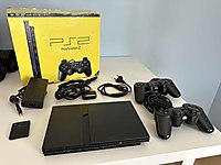 PS2 Slim kutulu + 8 oyunla birlikte